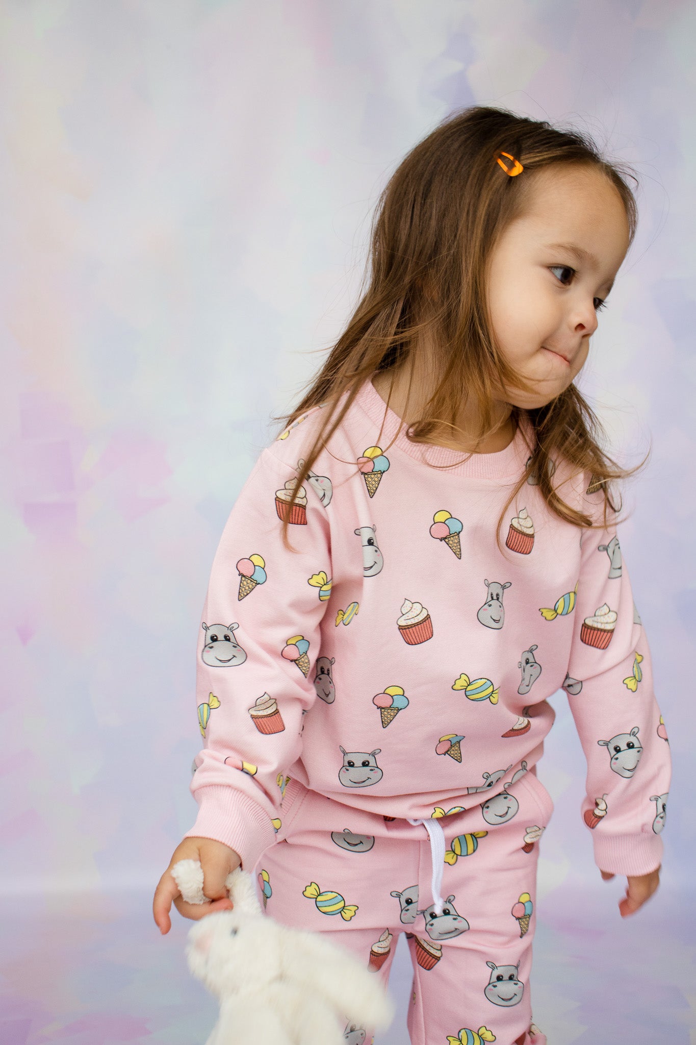 toddler girl wearing a kids lounge set with a cute hungry hippo candy print design