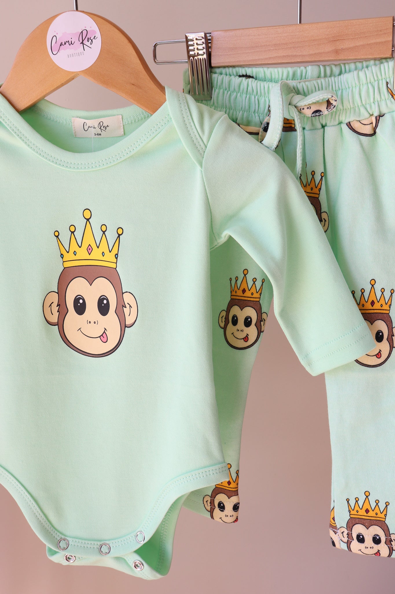 baby green long sleeve romper with a cute monkey design