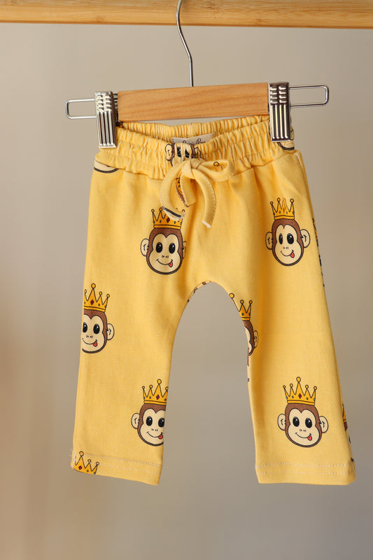 baby orange pants with a cute monkey design printed all over