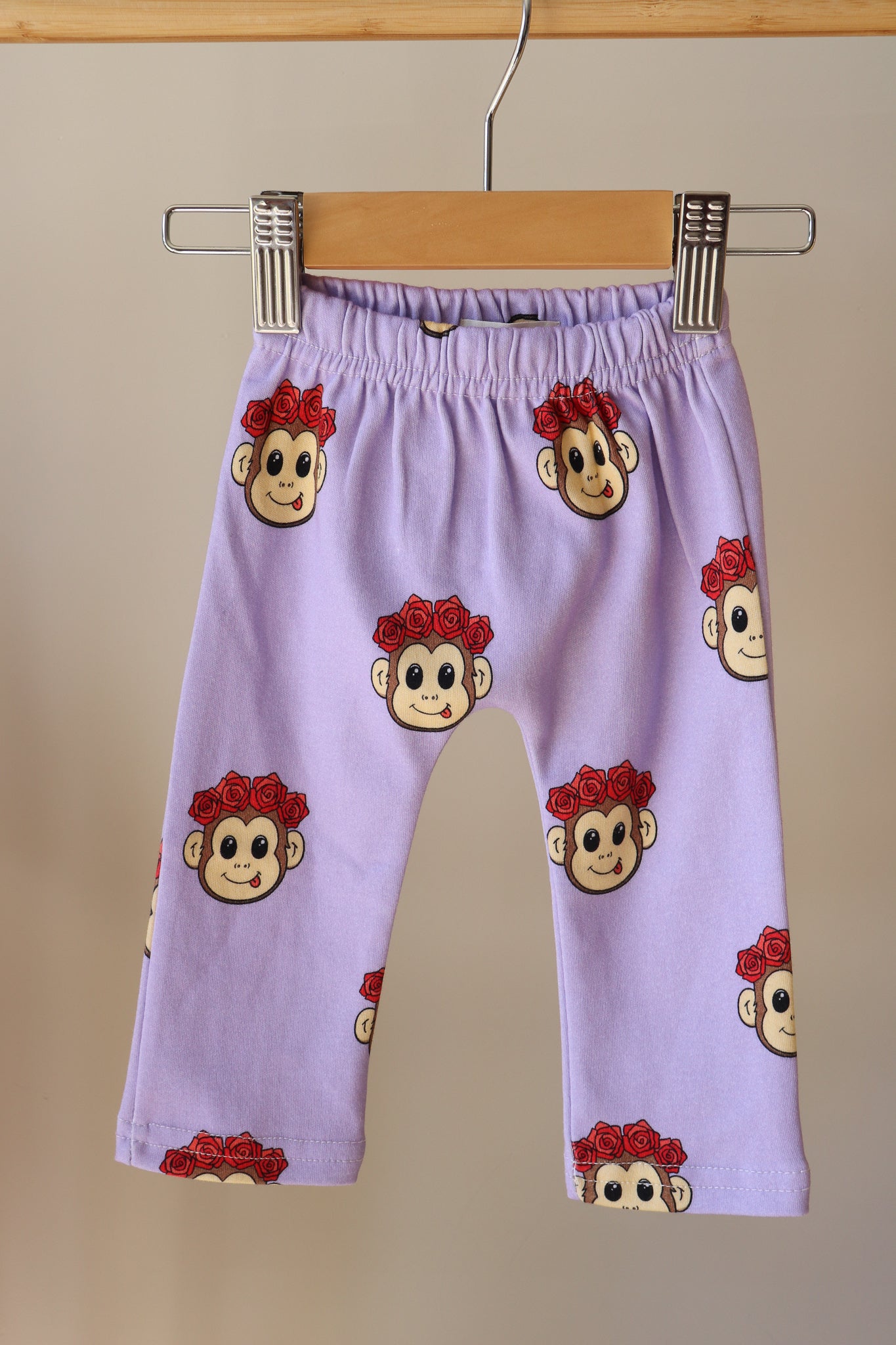 purple baby pants with a cute monkey design printed all over