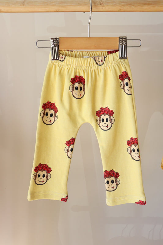 baby yellow pants with a cute monkey design printed all over